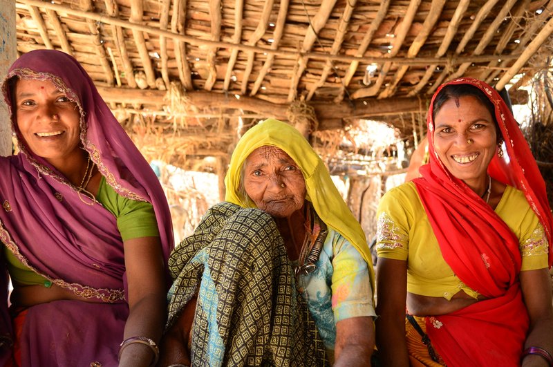 Chamnibai sits with her two daughters-in-law